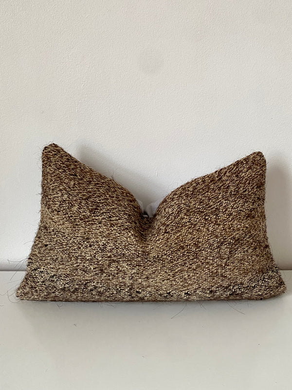 Textured Turkish Kilim brown pillow cover on a white background