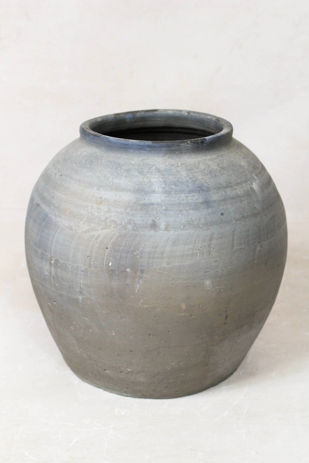 Eira Antique Terracotta Clay Pot on a white floor 