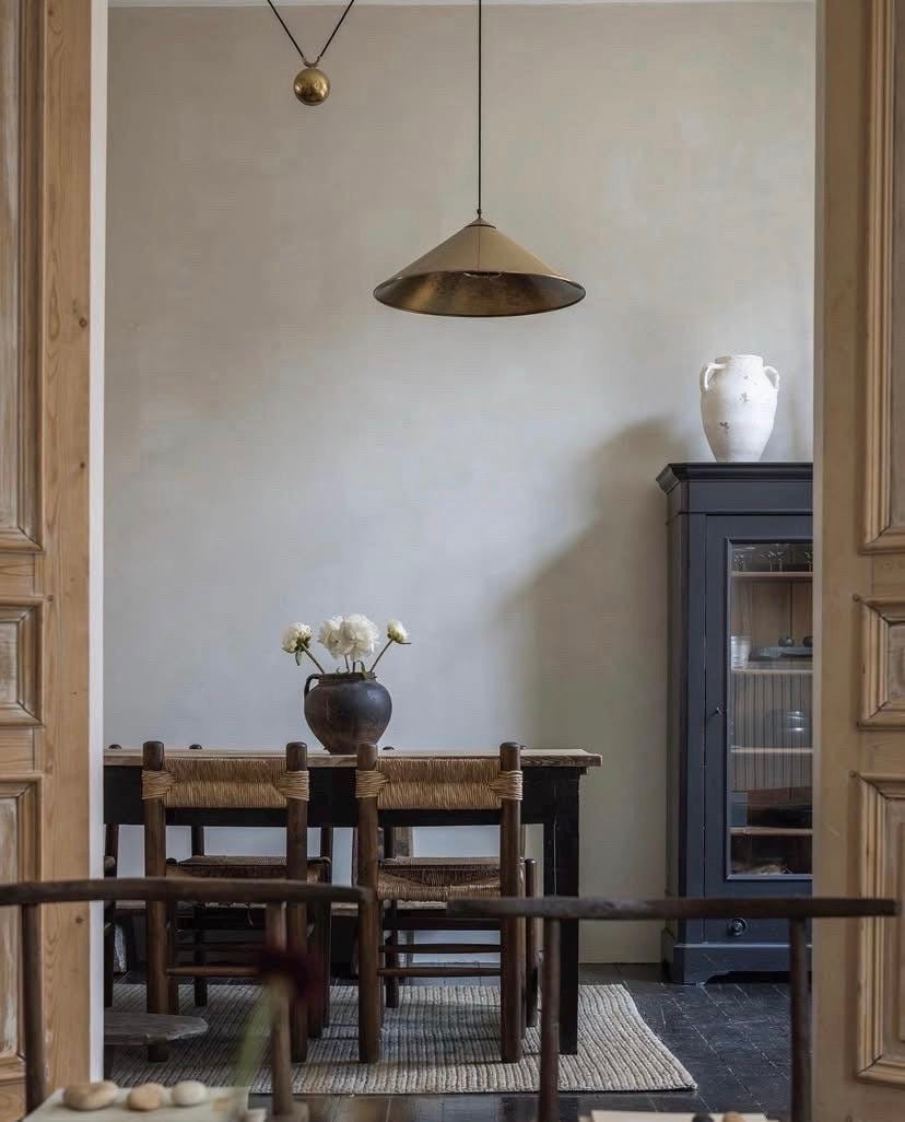 Black and Brown Rustic Terracotta Clay Pot on rustic wooden table styled in living room