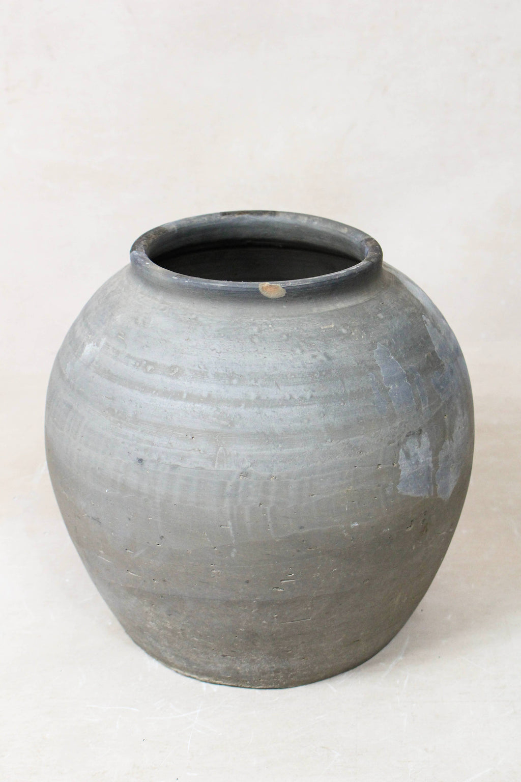Eira Antique Terracotta Clay Pot   on a white floor 