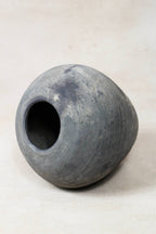 Grey antique clay pot on a white background