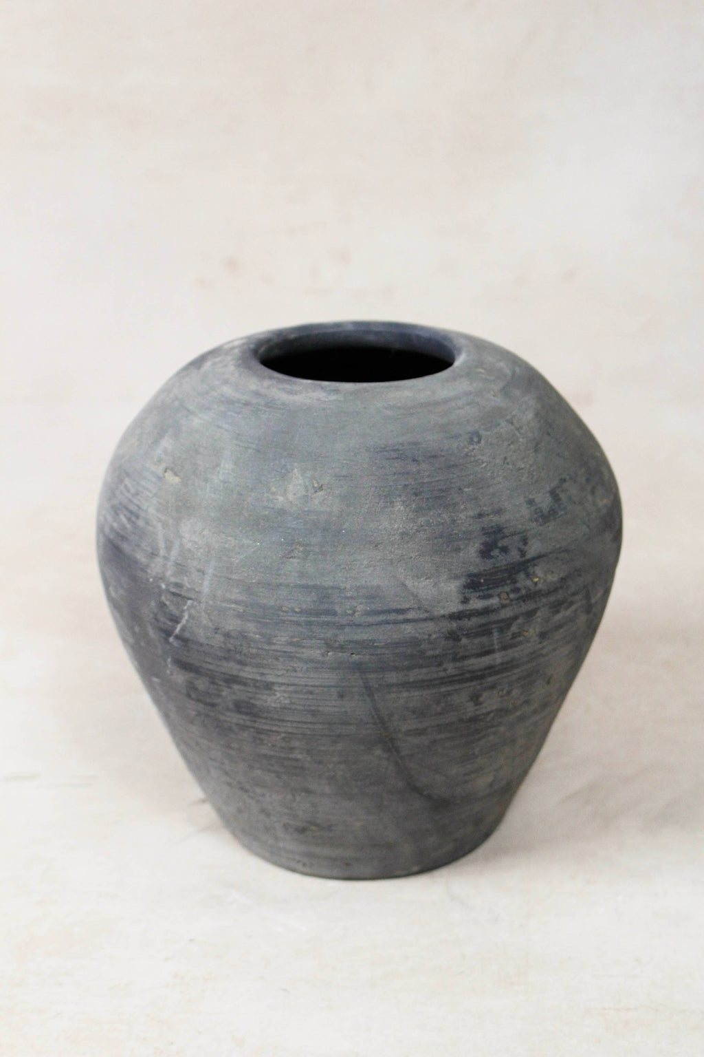 Antique clay vessel on a white background
