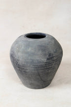 Antique clay vessel on a white background