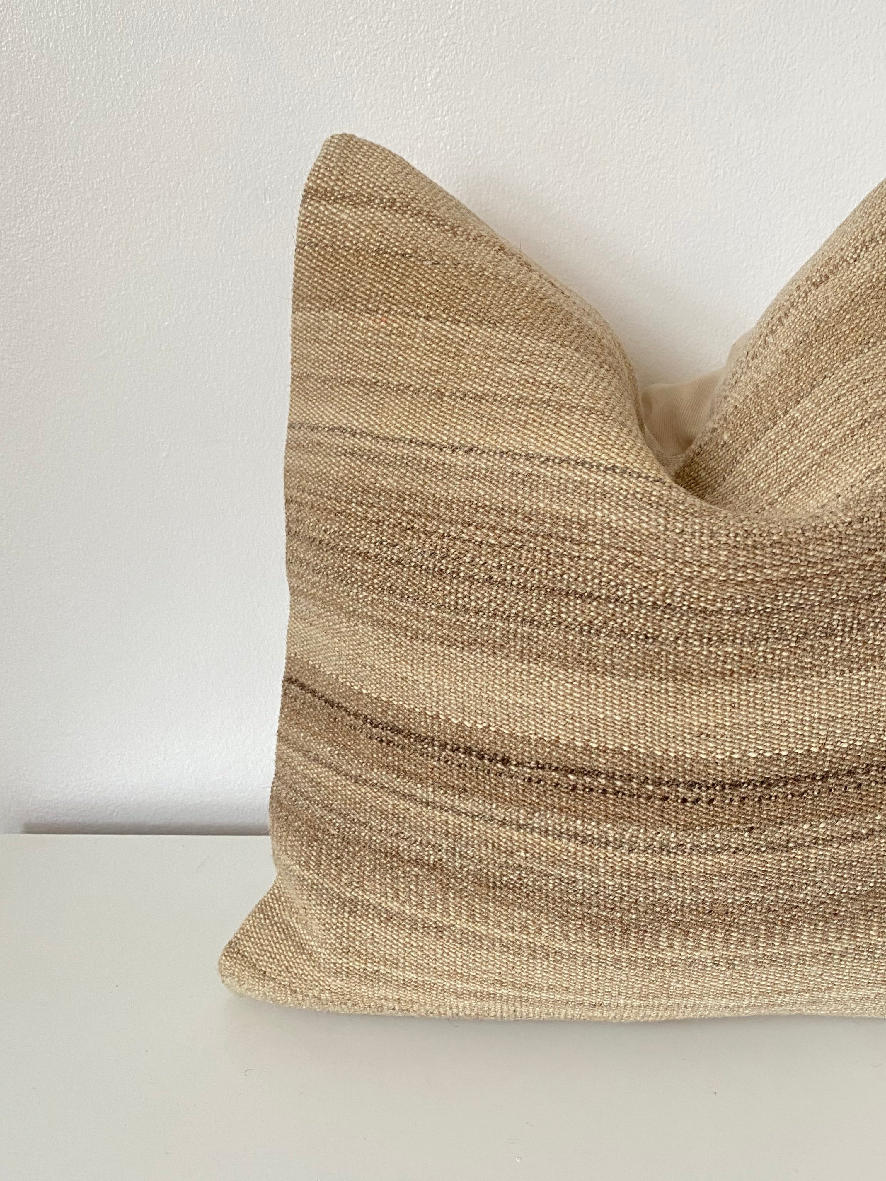 Beige textured Turkish Kilim pillow cover  on a white background