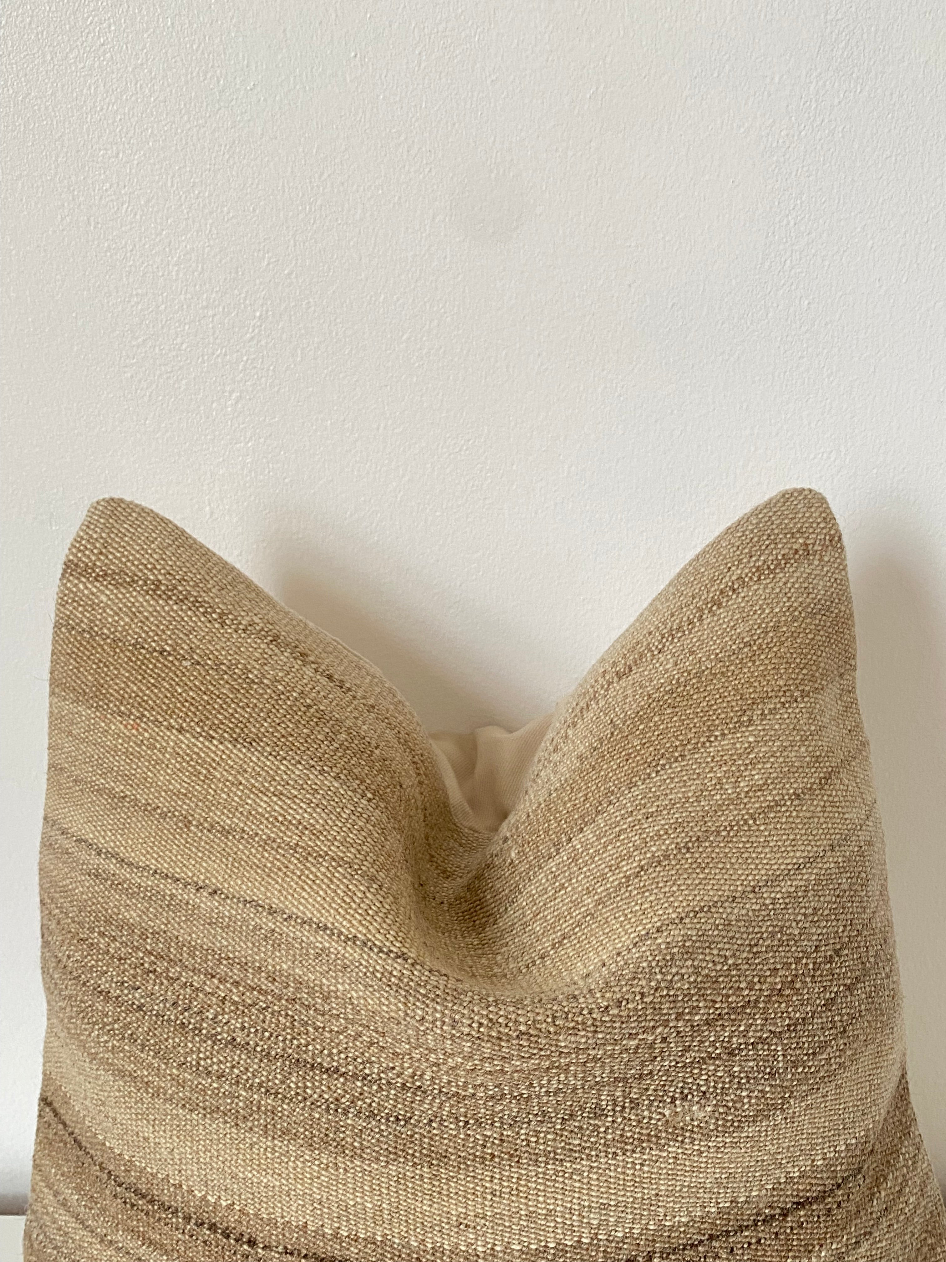 Textured beige Turkish pillow cover on a light gray background