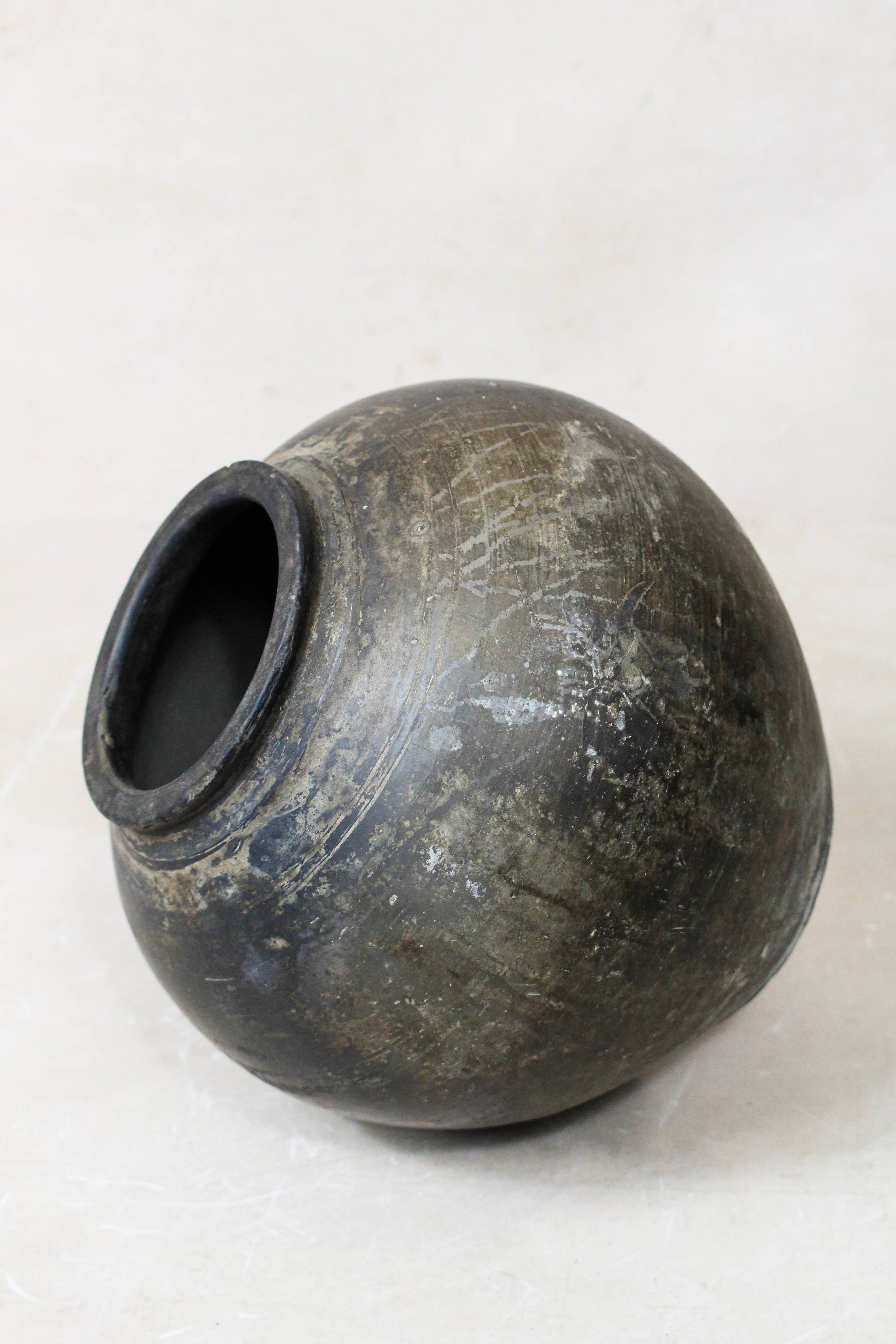 Dark Brown terracotta clay pot on a white background