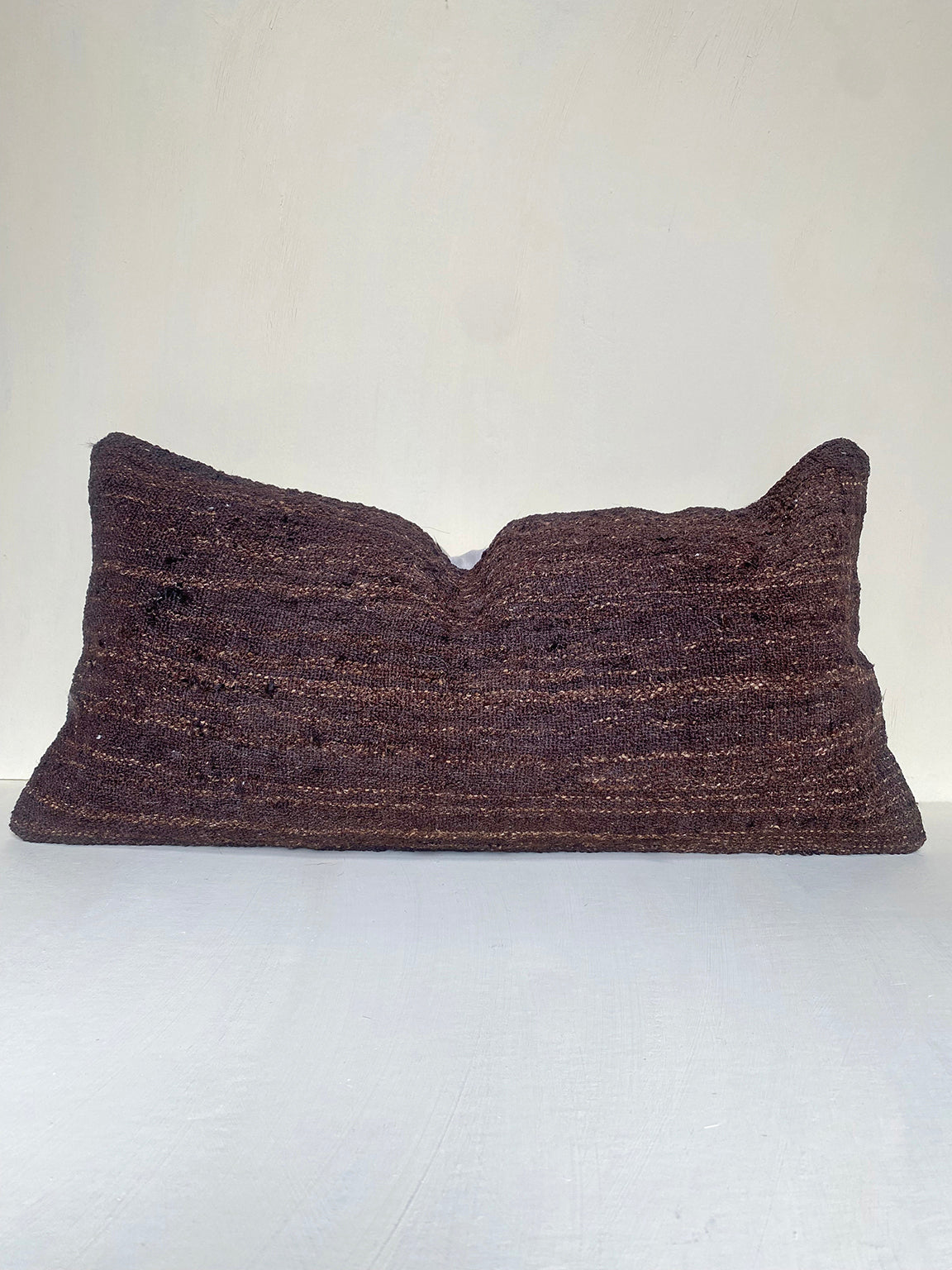 Handwoven vintage brown kilim cushion cover with rich earthy tones, made from Turkish wool – ideal for rustic living rooms and layered sofa styling.