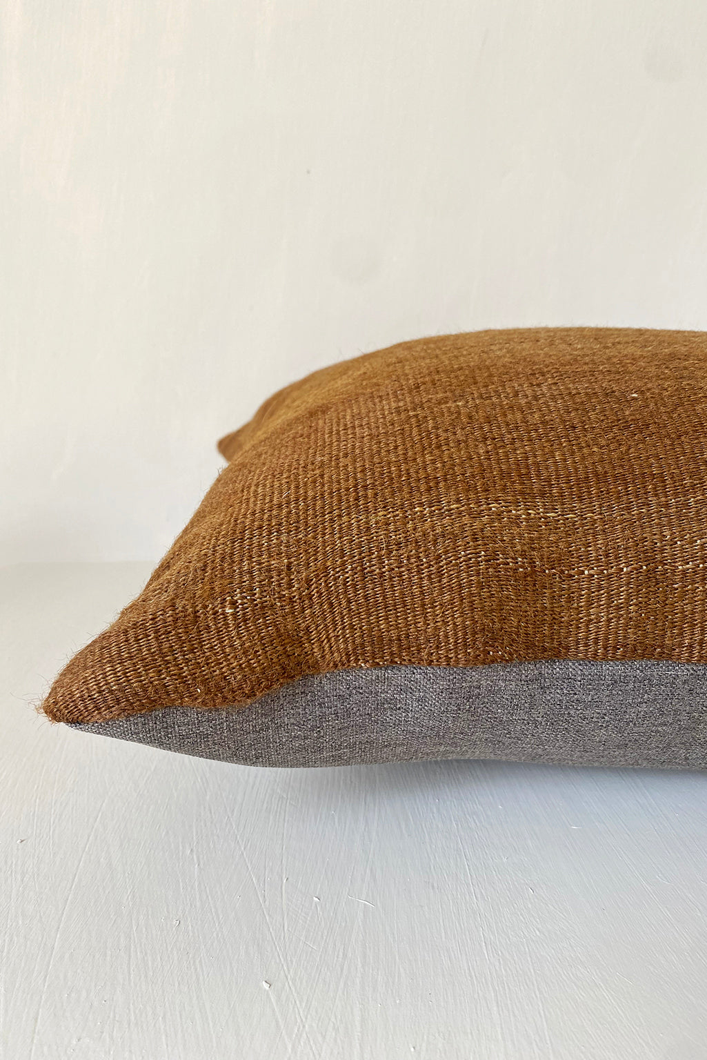 Handwoven camel brown kilim cushion cover made from vintage wool, ideal for rustic home decor and earthy, minimalist interiors.