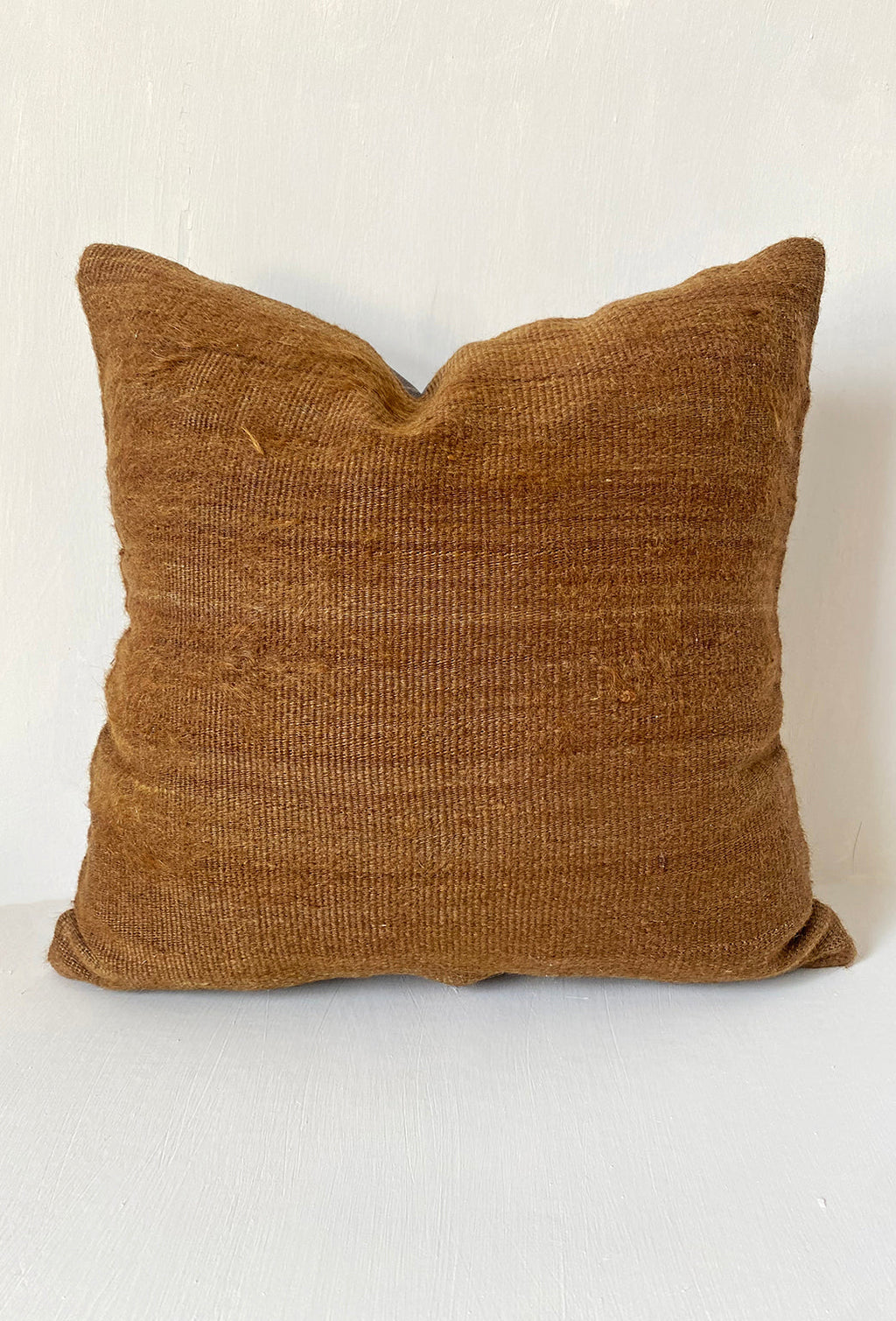 Handwoven camel brown kilim cushion cover made from vintage wool, ideal for rustic home decor and earthy, minimalist interiors.