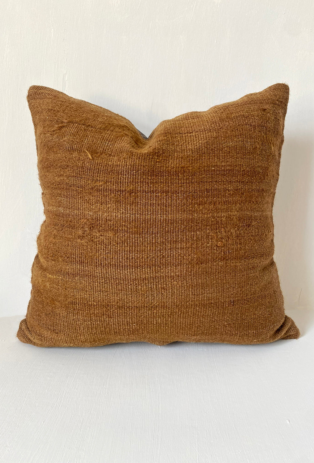 Handwoven camel brown kilim cushion cover made from vintage wool, ideal for rustic home decor and earthy, minimalist interiors.