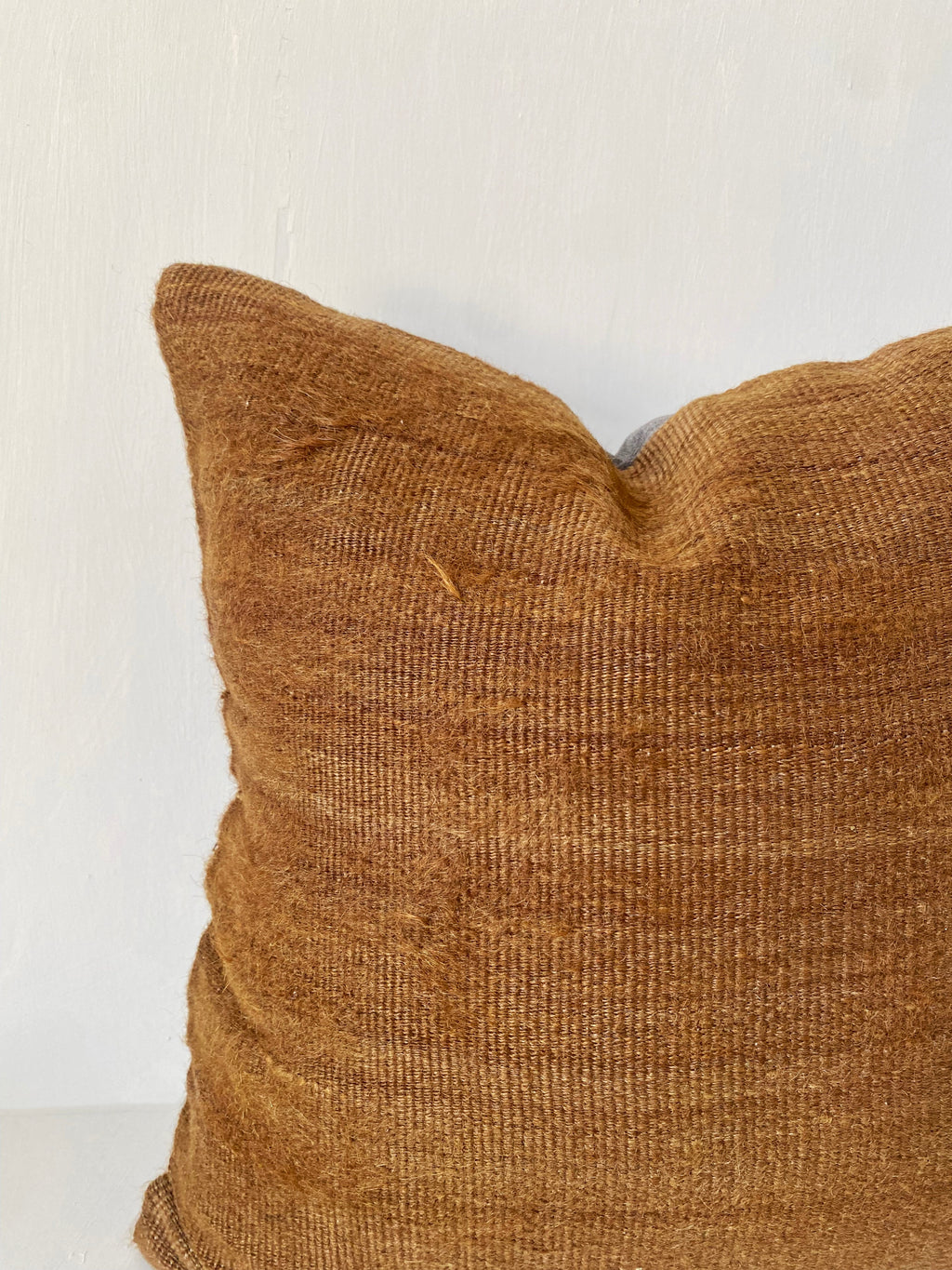 Handwoven camel brown kilim cushion cover made from vintage wool, ideal for rustic home decor and earthy, minimalist interiors.