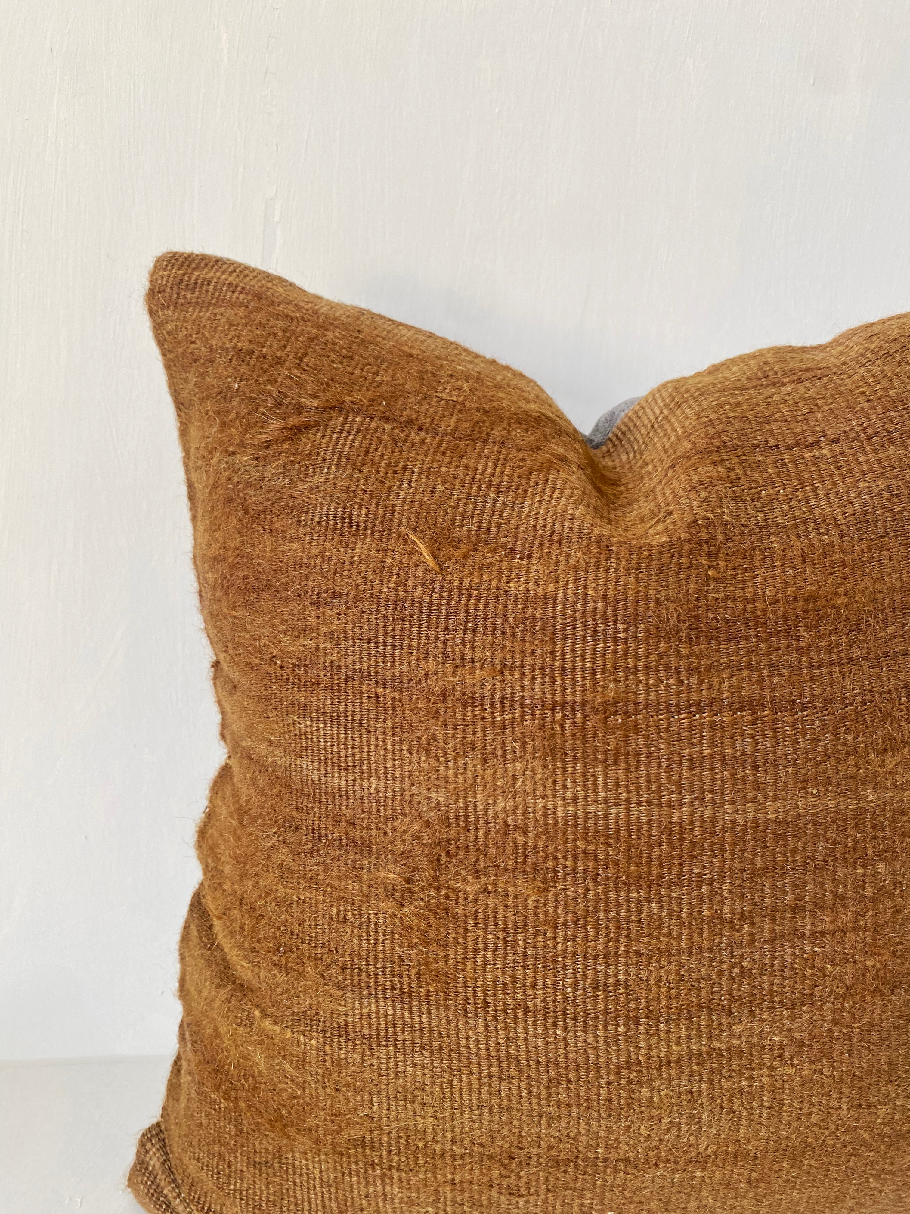 Handwoven camel brown kilim cushion cover made from vintage wool, ideal for rustic home decor and earthy, minimalist interiors.