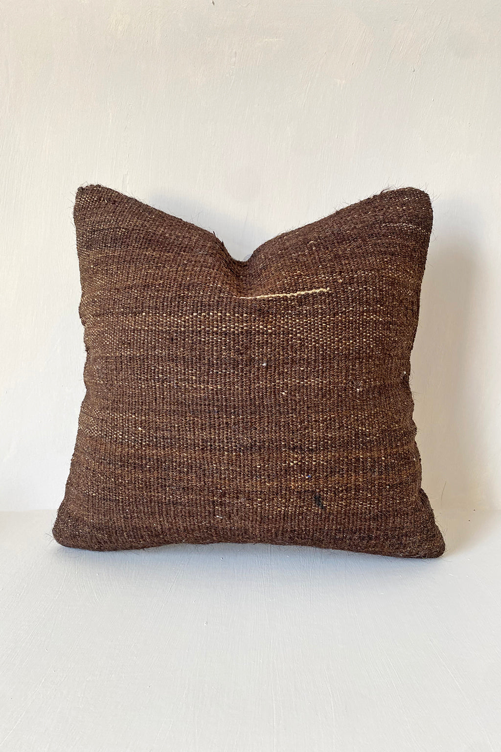 Dark brown vintage Turkish kilim cushion pillow cover made from handwoven wool, perfect for rustic interiors, earthy tones, and minimalist home decor.