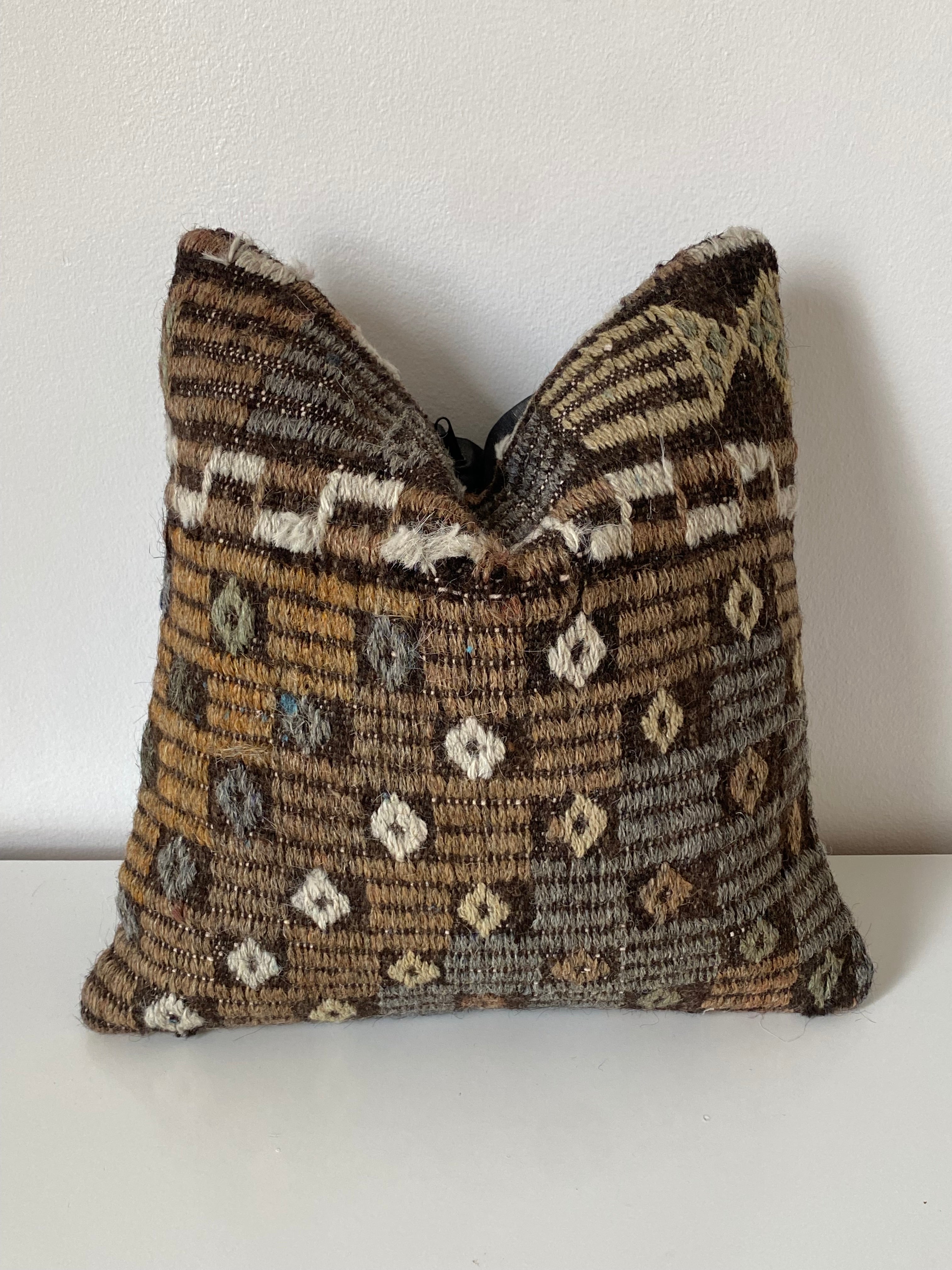 Turkish Kilim Decorative pillow cover with a brown and beige pattern on a white background