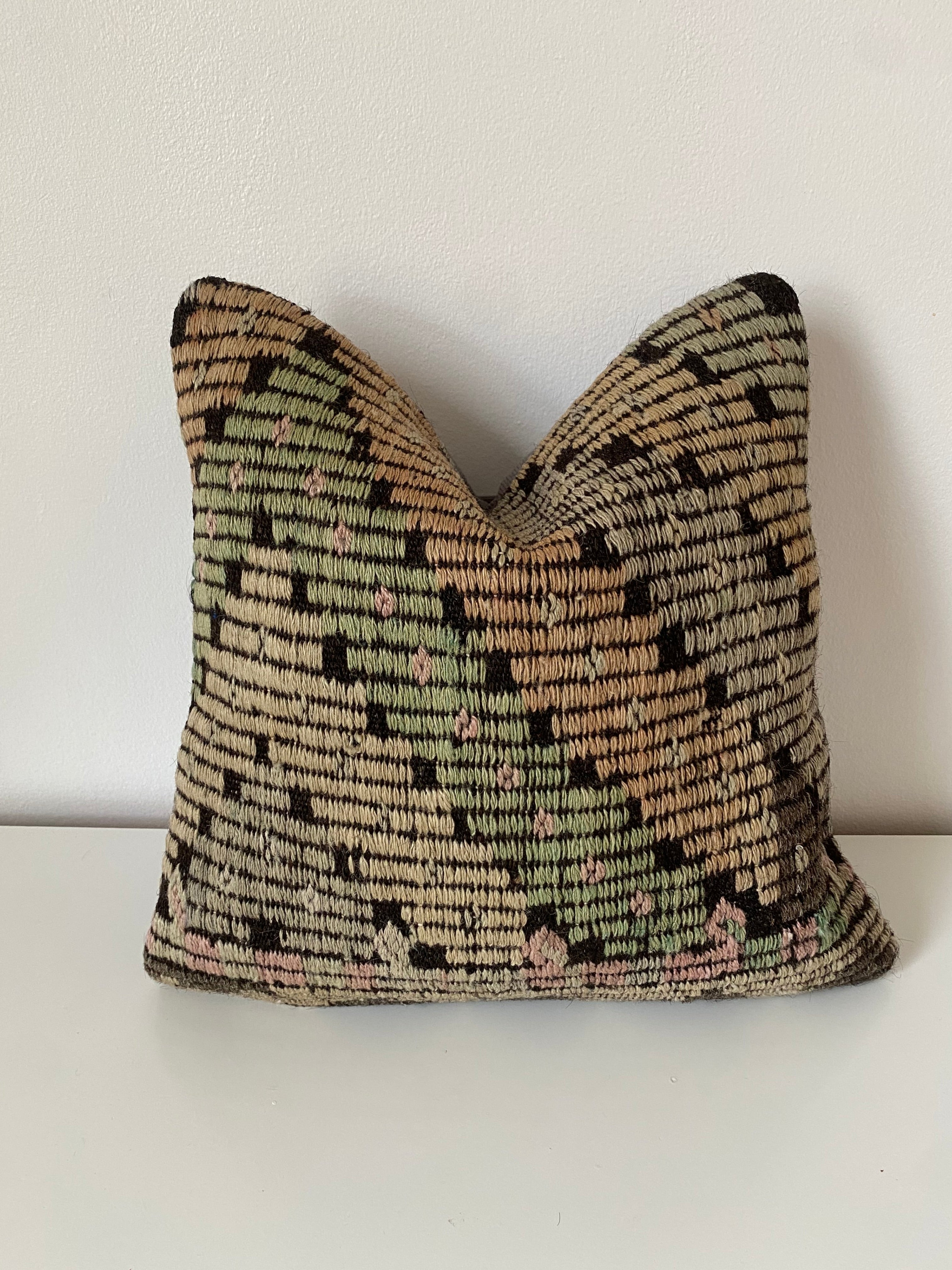 Textured Turkish Kilim pillow cover with geometric pattern on a white background