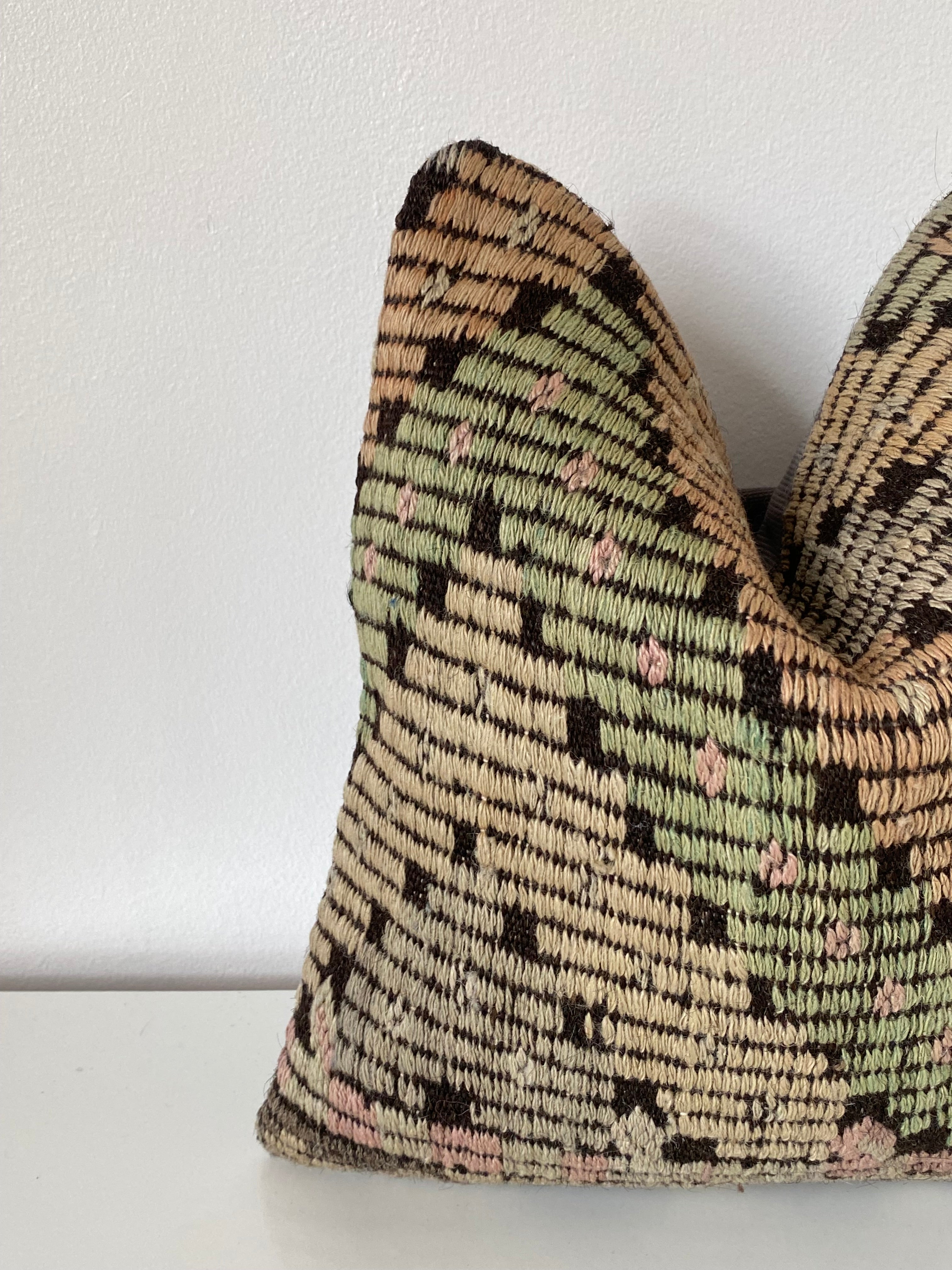 Textured Turkish Kilim pillow cover with geometric pattern on a white background