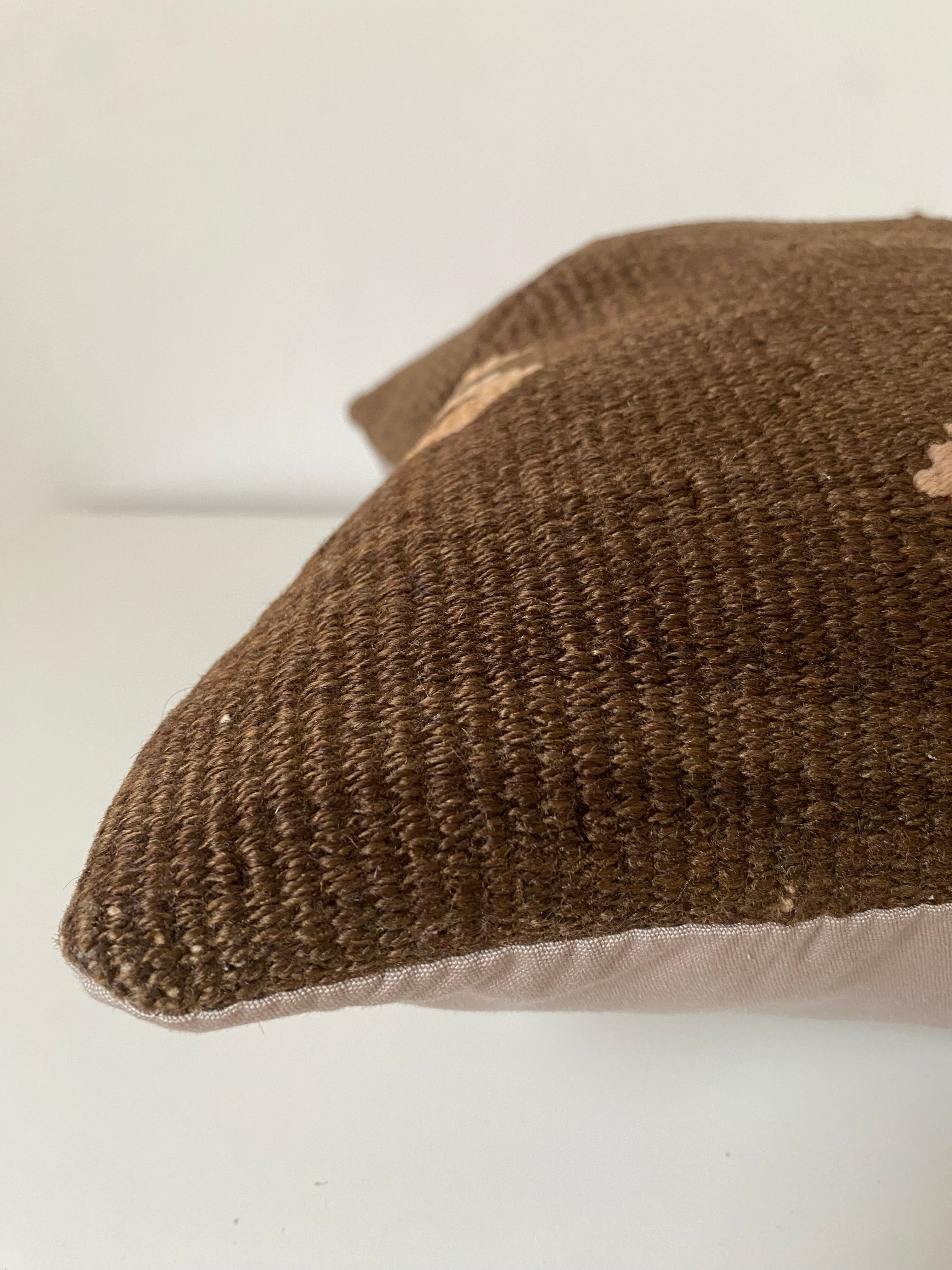 Textured Brown Turkish Kilim pillow cover  on a white background