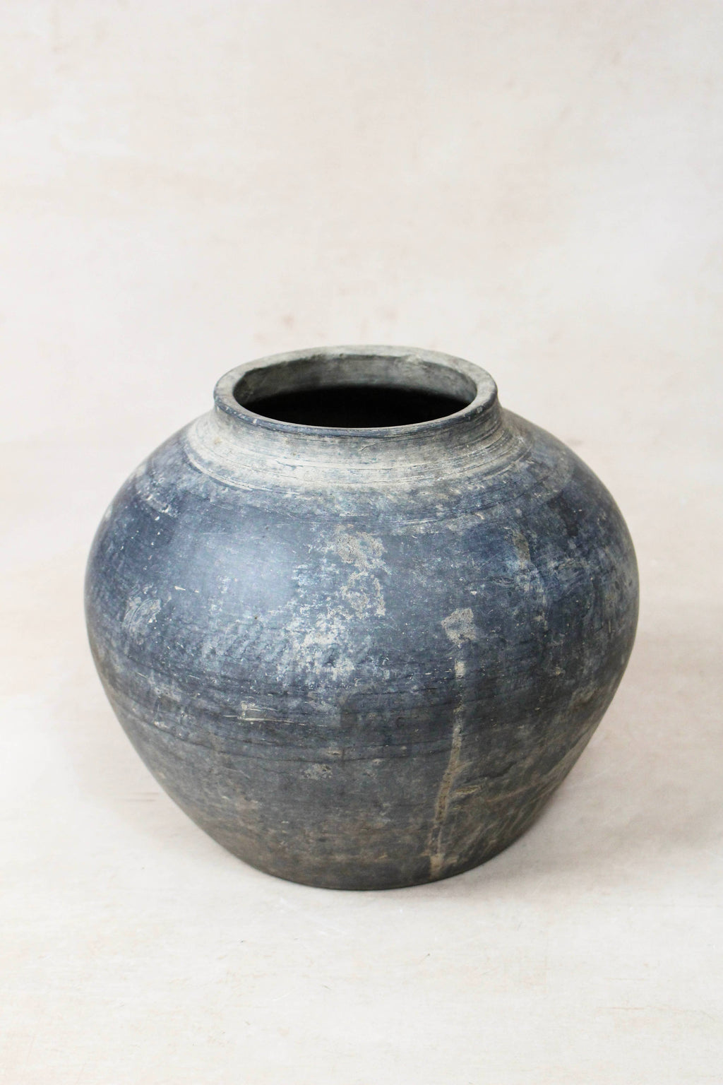 Dark Grey clay pot on a white background