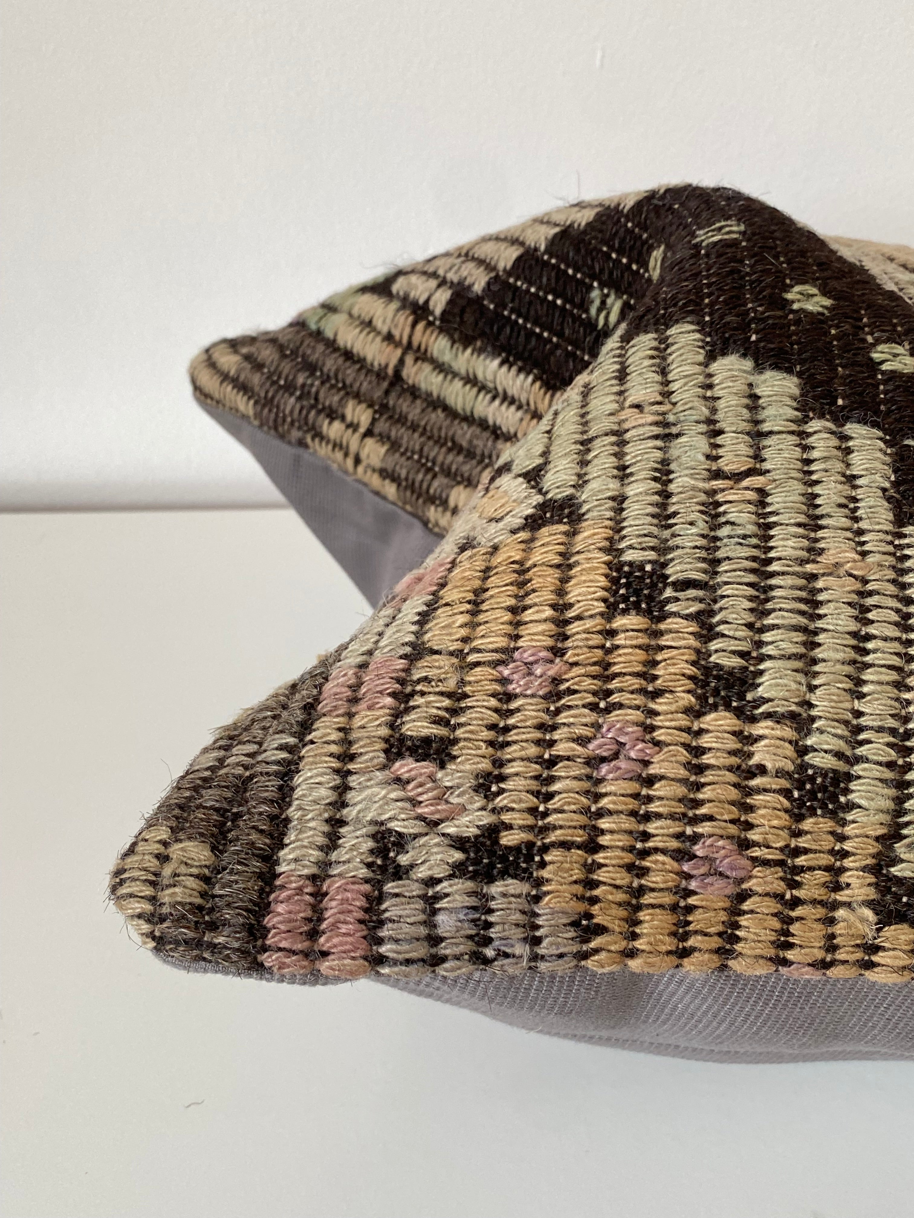 Textured Turkish Kilim pillow cover handwoven wool with a geometric pattern on a white background