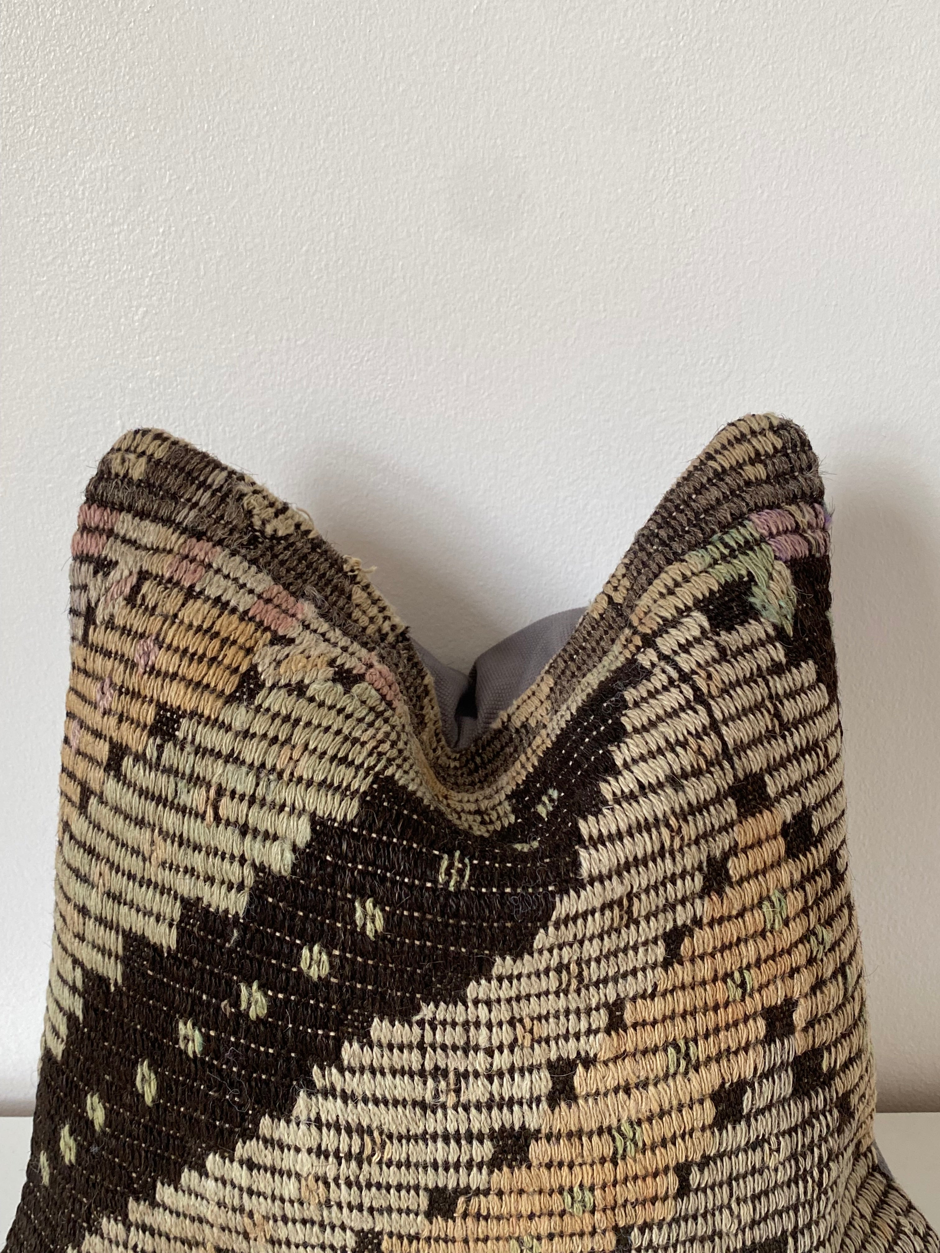 Textured Turkish Kilim pillow cover with geometric pattern on a white background