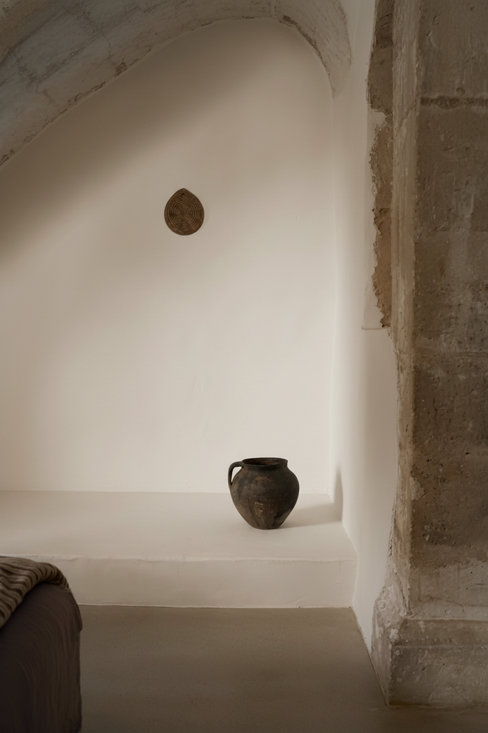 Minimalist interior with single clay pot