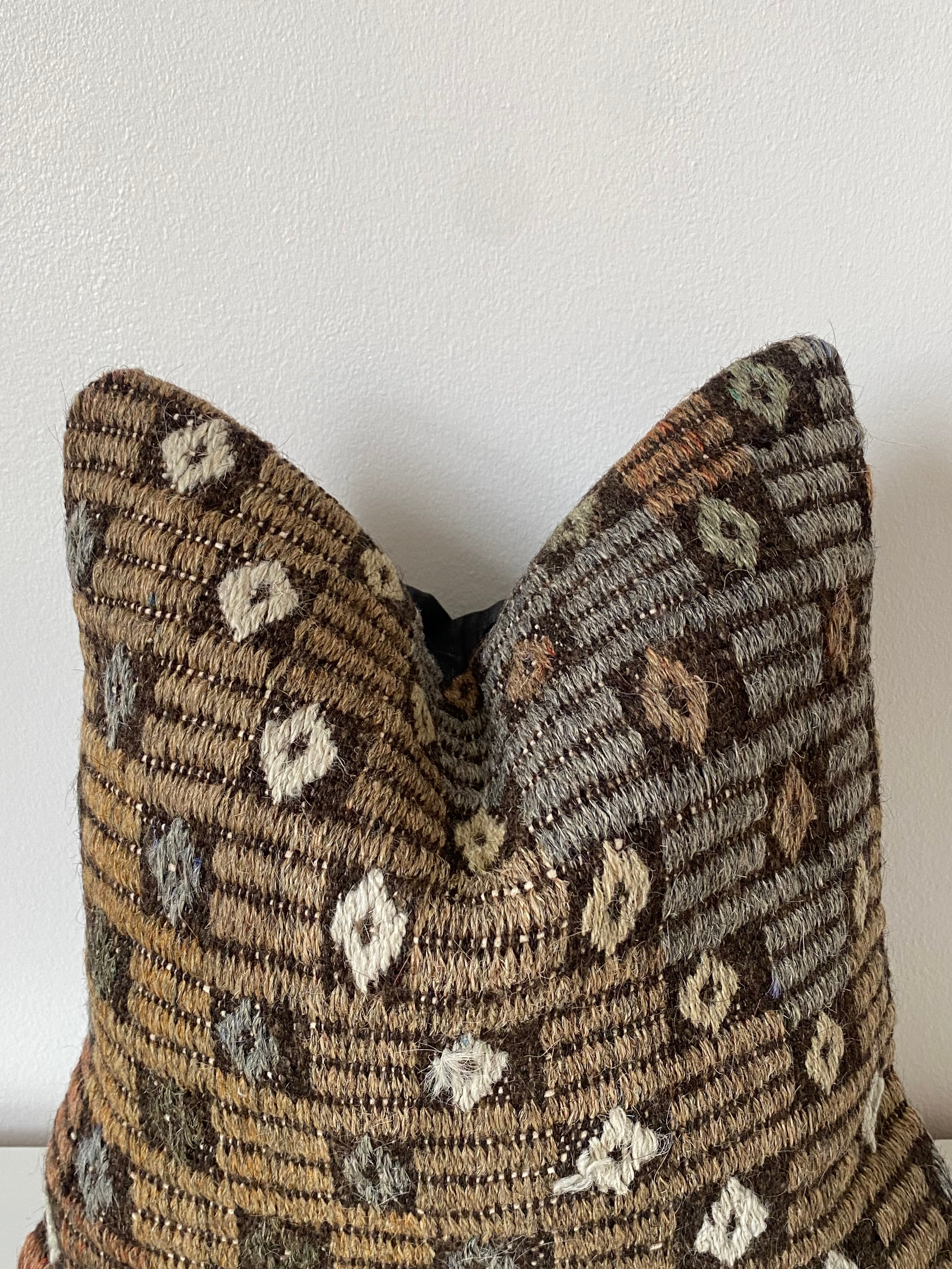 Decorative Turkish Kilim pillow cover with a geometric pattern on a white background