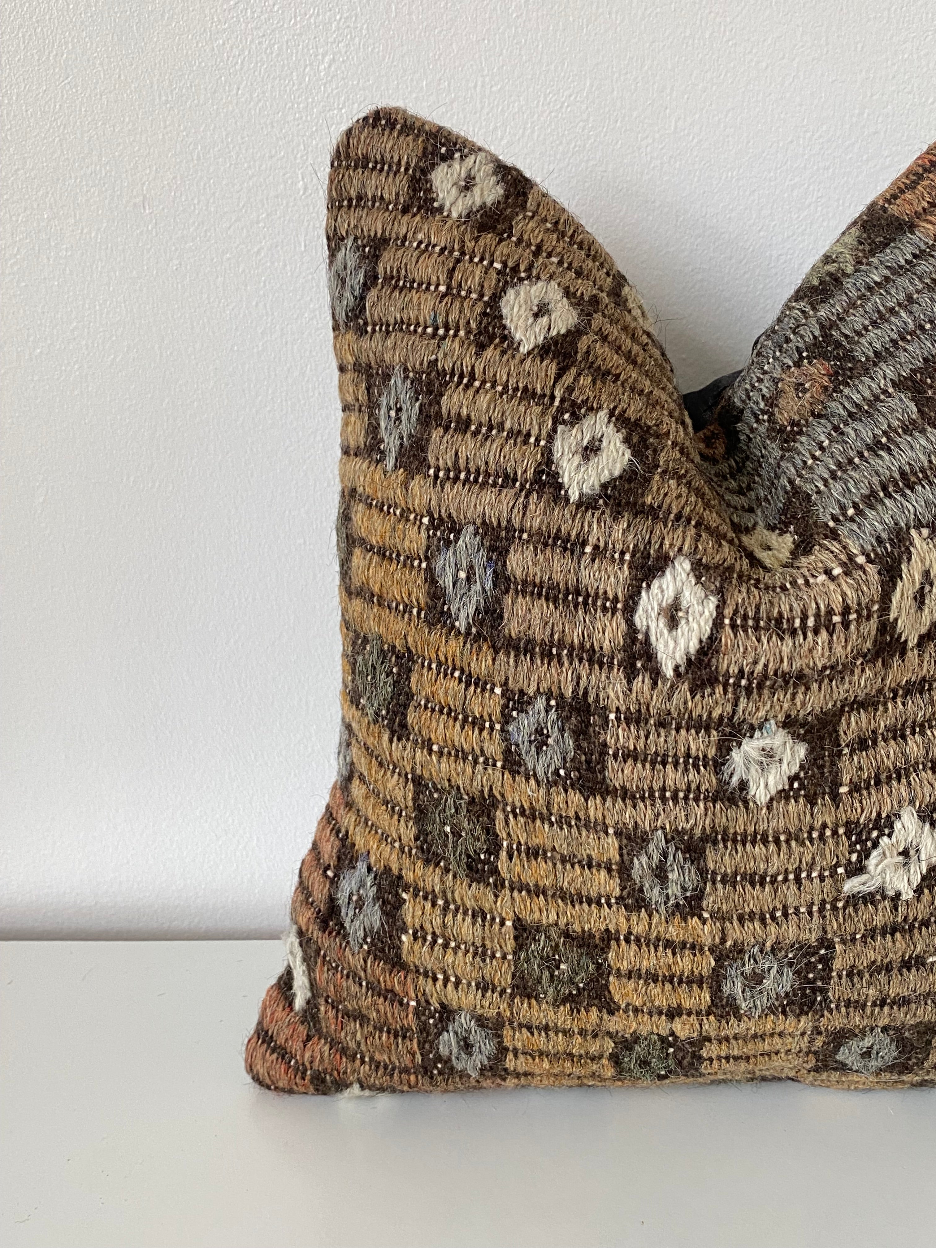 Textured Turkish Kilim pillow cover with geometric pattern on a white background