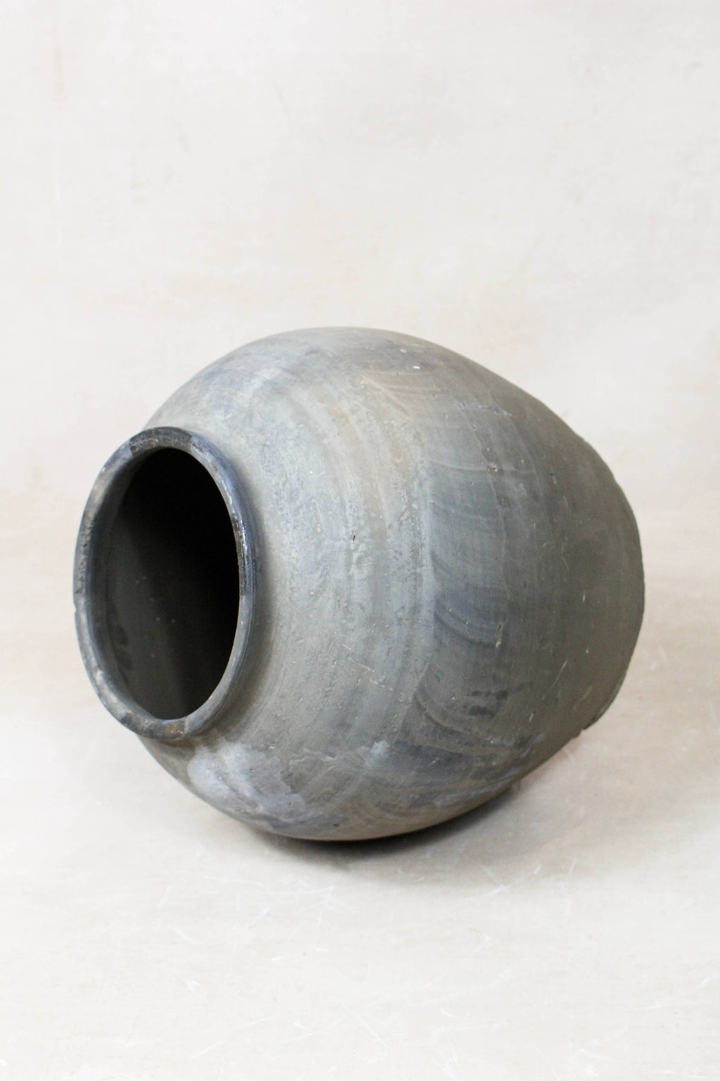 Eira Grey Antique Terracotta Clay Pot  on a white floor 